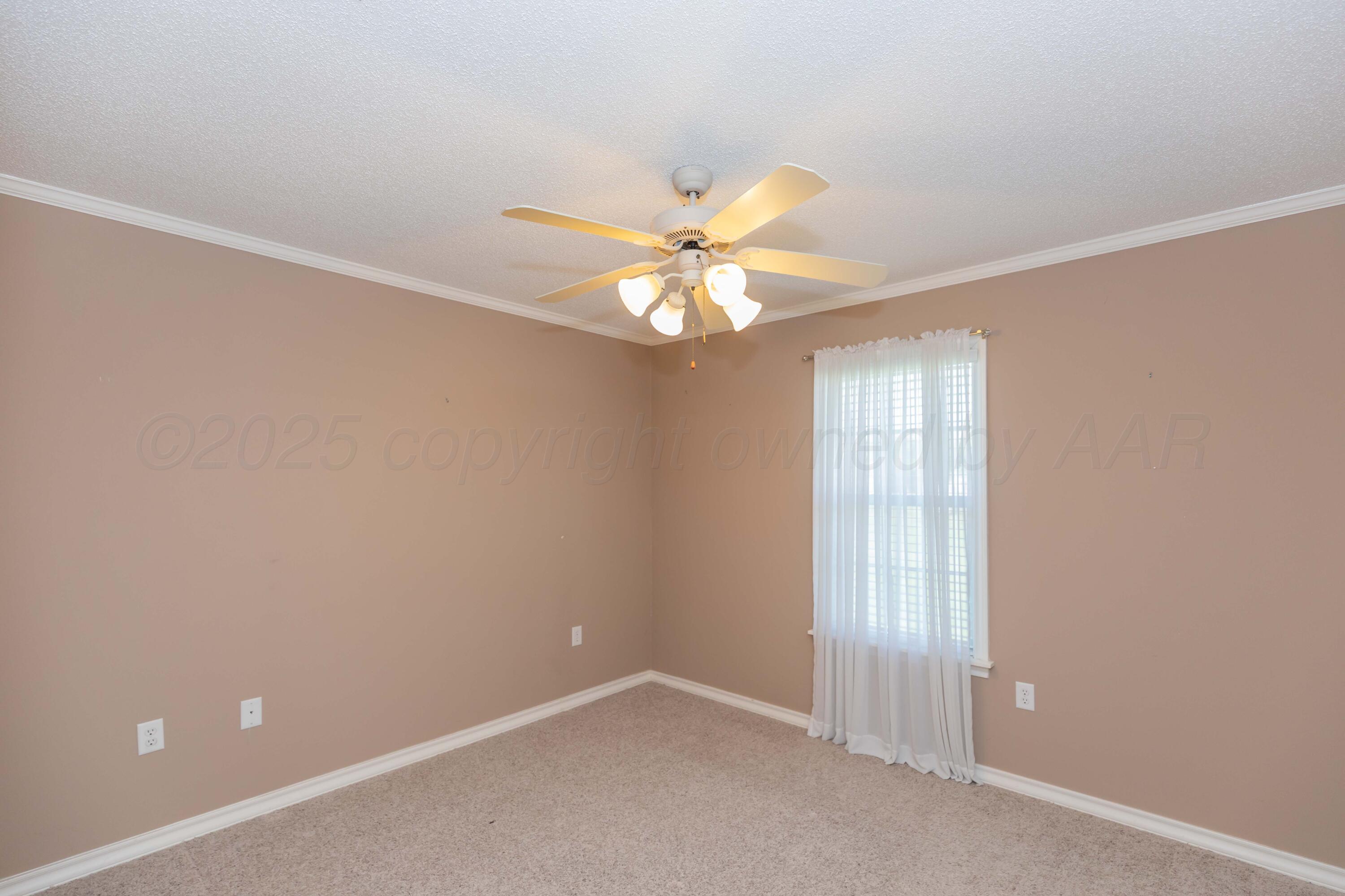 109 Texas Avenue Groom, TX 79039 - Photo 15 of 21 an empty room with windows and fan