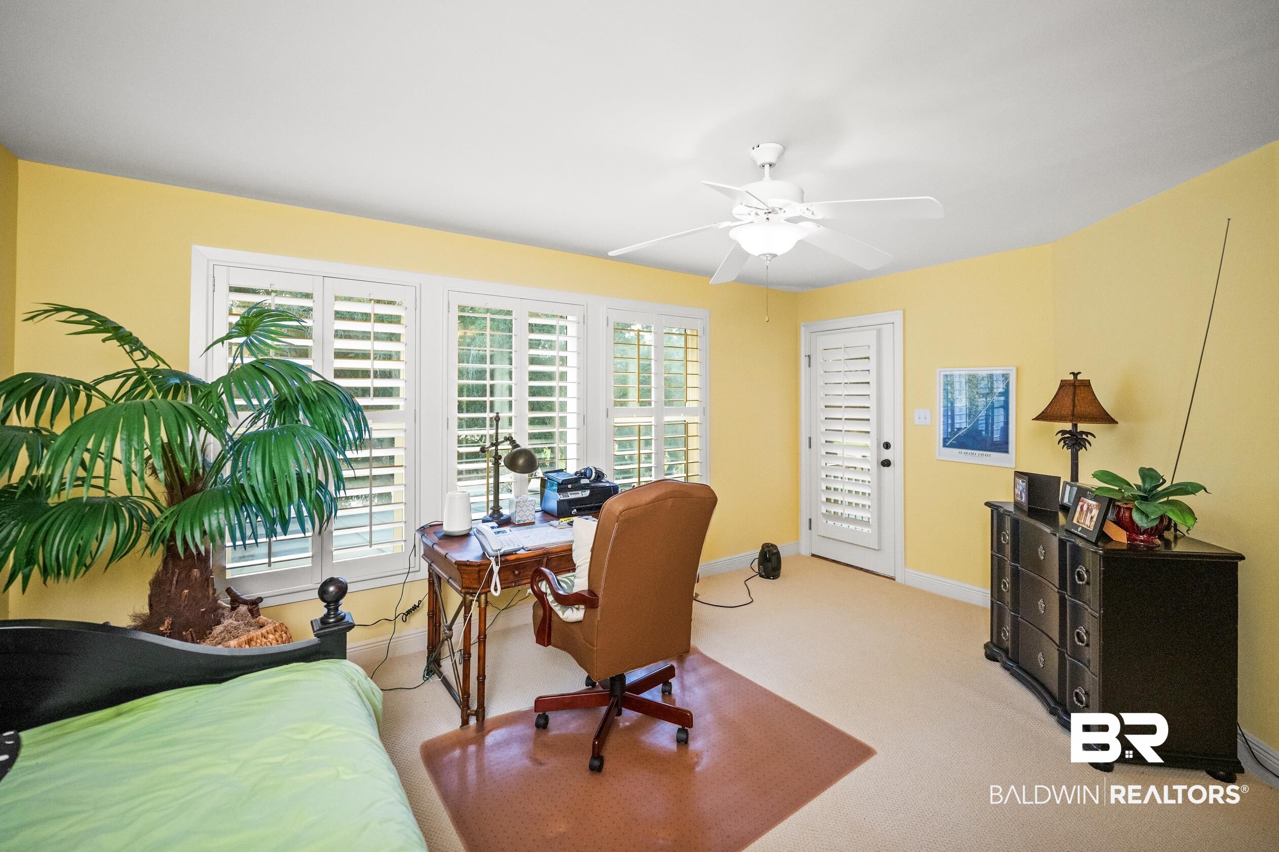 404 Peninsula Boulevard Gulf Shores, AL 36542 - Photo 28 of 51 Bedroom featuring a desk, carpet floors, a ceiling fan, and access to exterior