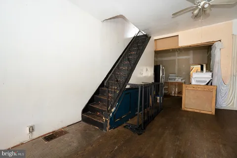 a room with furniture and stairs