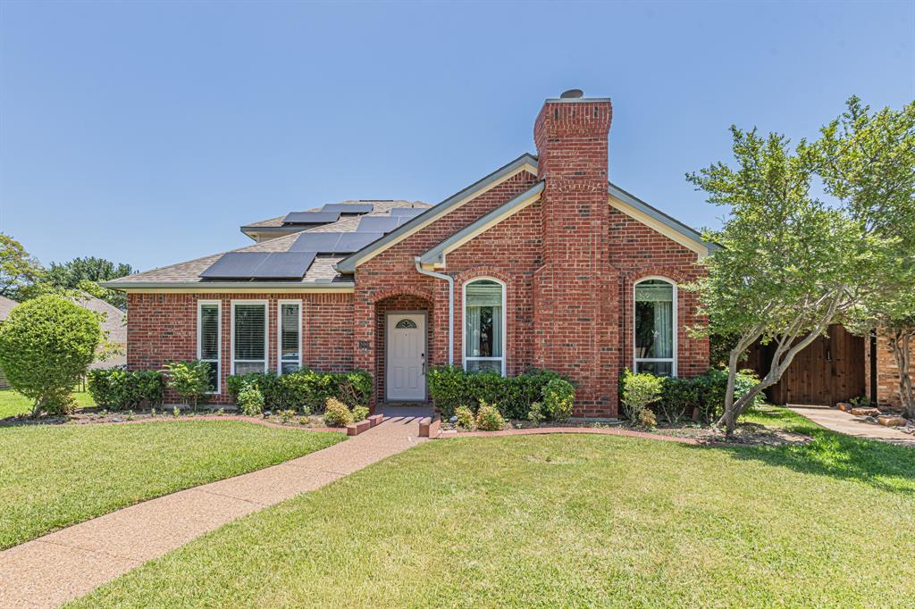 300 Sundance Circle Irving, TX 75063 - Photo 1 of 39 Brick facade home with multiple roof-mounted solar panels