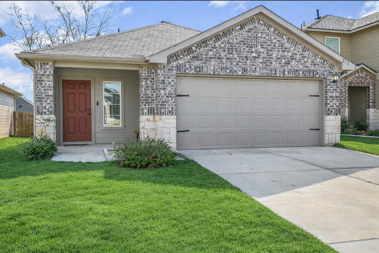 front view of a house with a yard