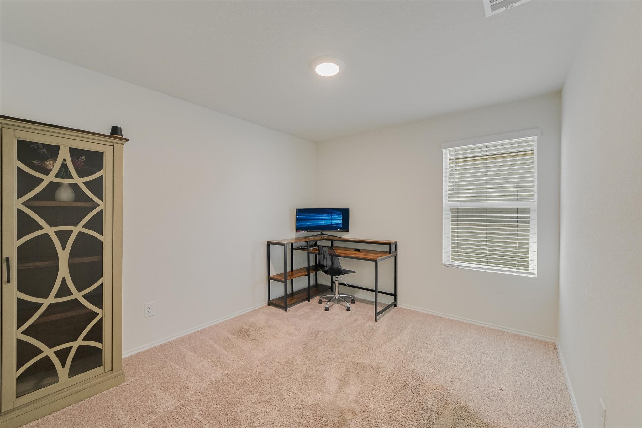 232 Euclid Lane Kyle, TX 78640 - Photo 11 of 15 an empty room with furniture and a window
