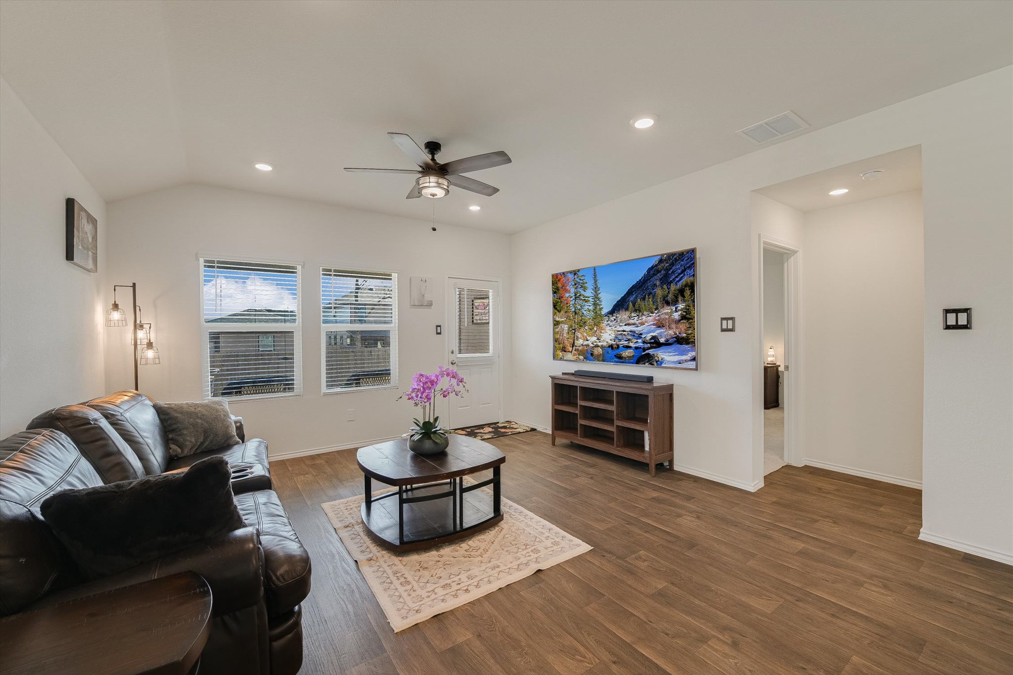 232 Euclid Lane Kyle, TX 78640 - Photo 2 of 15 a living room with furniture flat screen tv and wooden floor