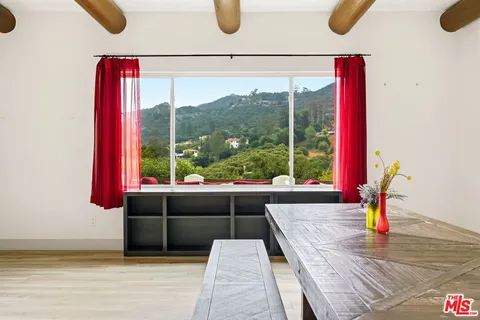 a kitchen with stainless steel appliances a sink stove and cabinets