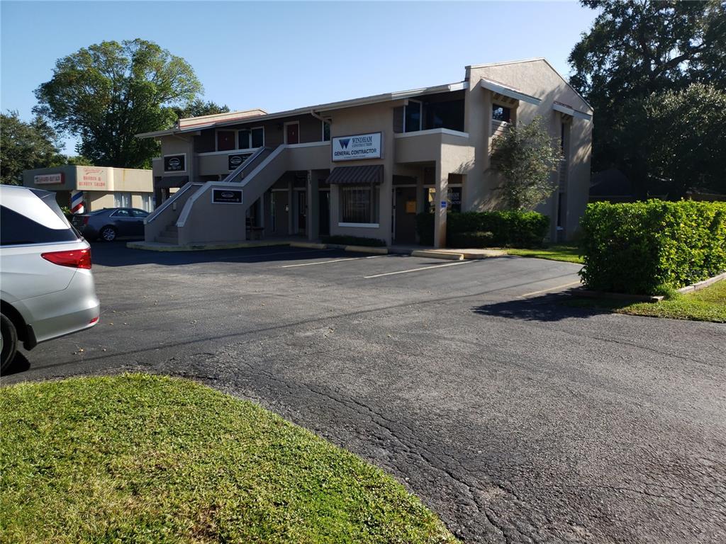 623 39th Street West, Unit 2 Bradenton, FL 34205 - Photo 1 of 1 a front view of a house with garden