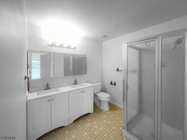 a view of a bathroom with a sink mirror and toilet