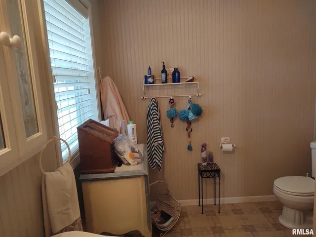 a bathroom with a toilet and a sink