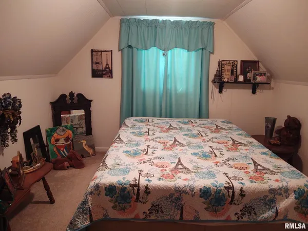 a bedroom with a bed and green walls