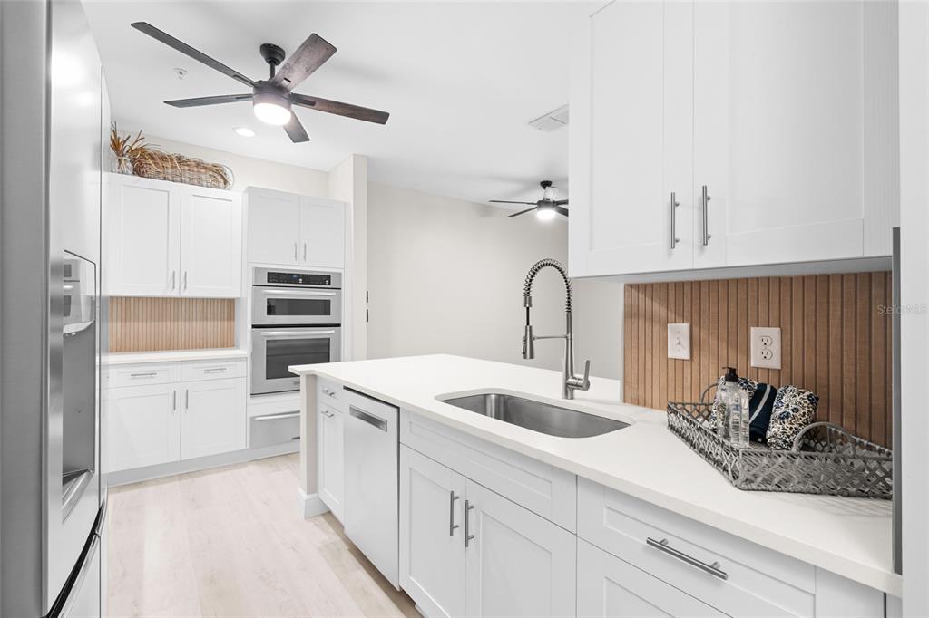 4221 West Spruce Street, Unit 1108 Tampa, FL 33607 - Photo 13 of 31 a kitchen with a sink and a refrigerator