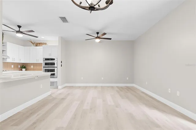 a view of a kitchen with a sink and a stove top oven