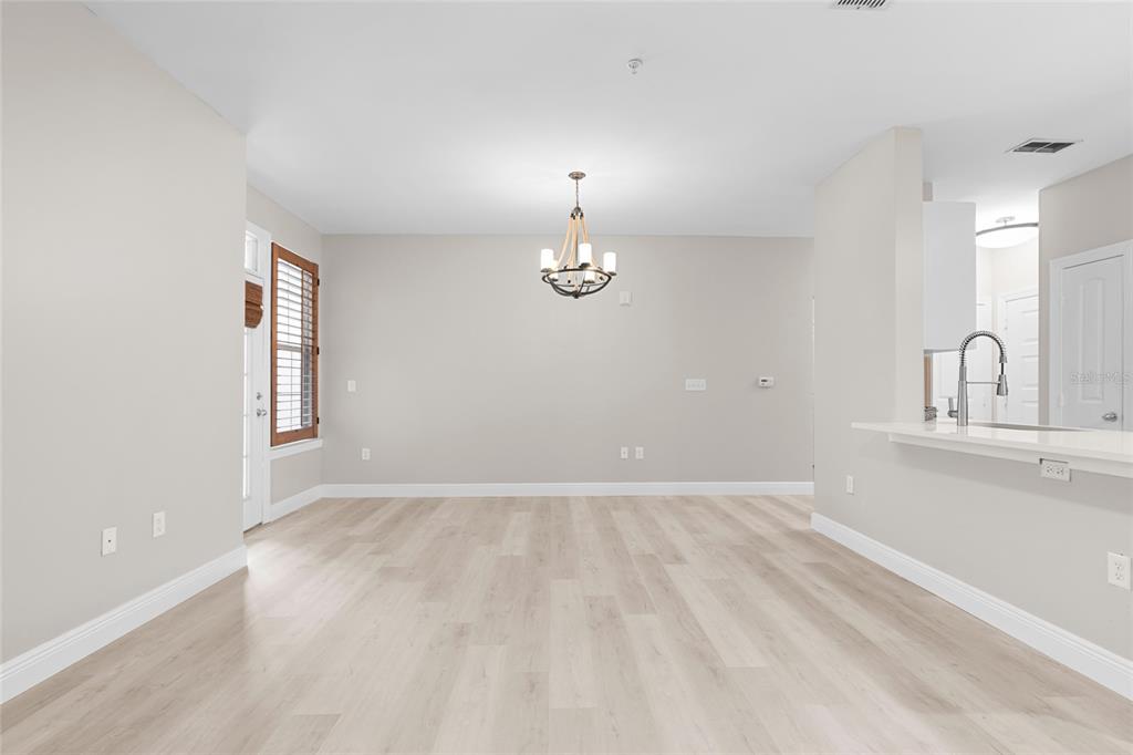 4221 West Spruce Street, Unit 1108 Tampa, FL 33607 - Photo 18 of 31 a view of an empty room with window and wooden floor