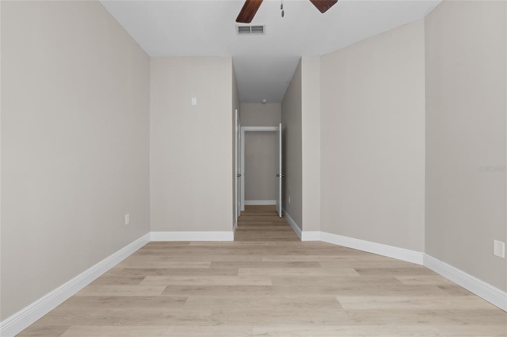 4221 West Spruce Street, Unit 1108 Tampa, FL 33607 - Photo 22 of 31 a view of an empty room with wooden floor