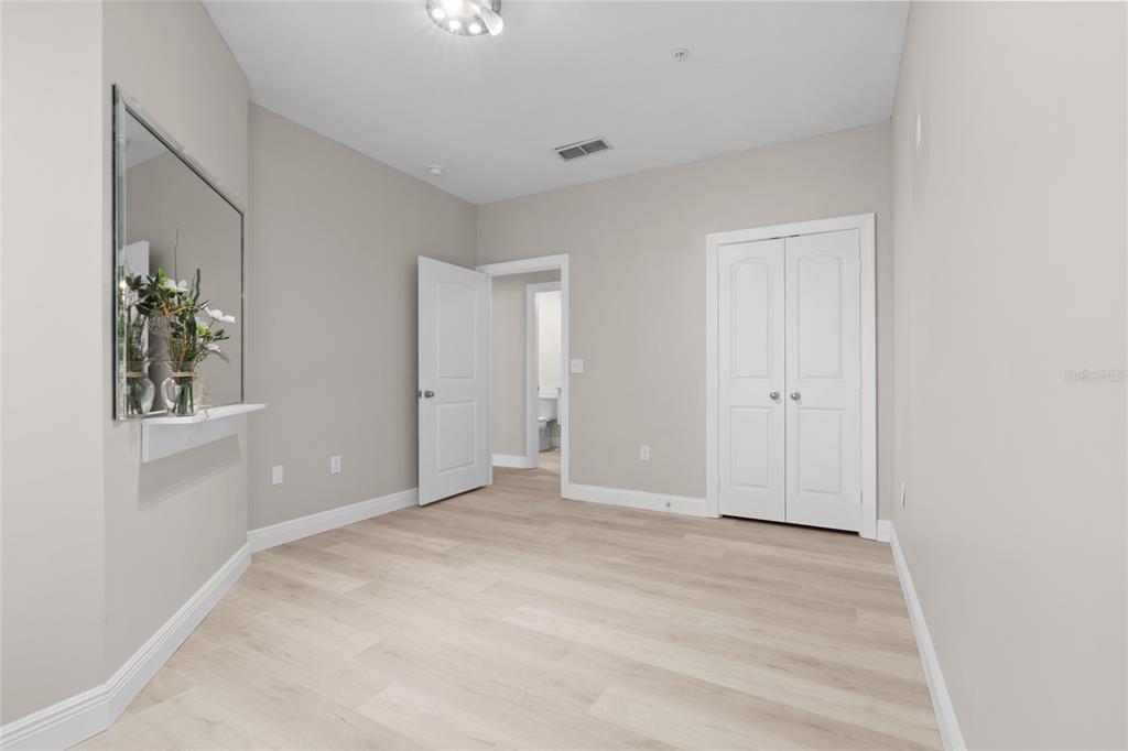 4221 West Spruce Street, Unit 1108 Tampa, FL 33607 - Photo 26 of 31 a view of an empty room with window and wooden floor