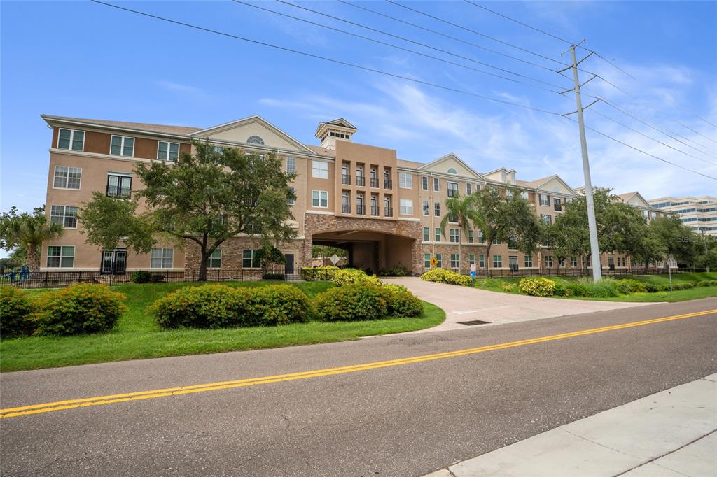 4221 West Spruce Street, Unit 1108 Tampa, FL 33607 - Photo 31 of 31 a view of a building with a yard
