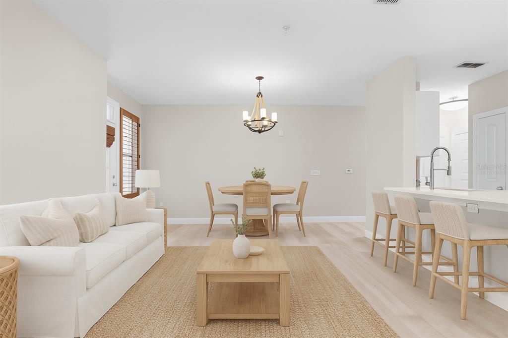 4221 West Spruce Street, Unit 1108 Tampa, FL 33607 - Photo 4 of 31 a dining room with furniture and a chandelier