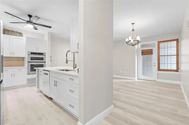 a spacious bathroom with a double vanity sink a mirror and a shower