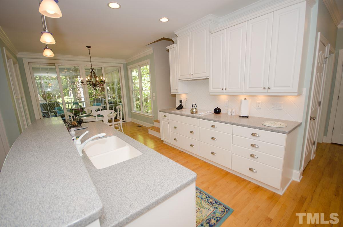 1106 Stanridge Drive Raleigh, NC 27613 - Photo 13 of 24 a large white kitchen with a large window