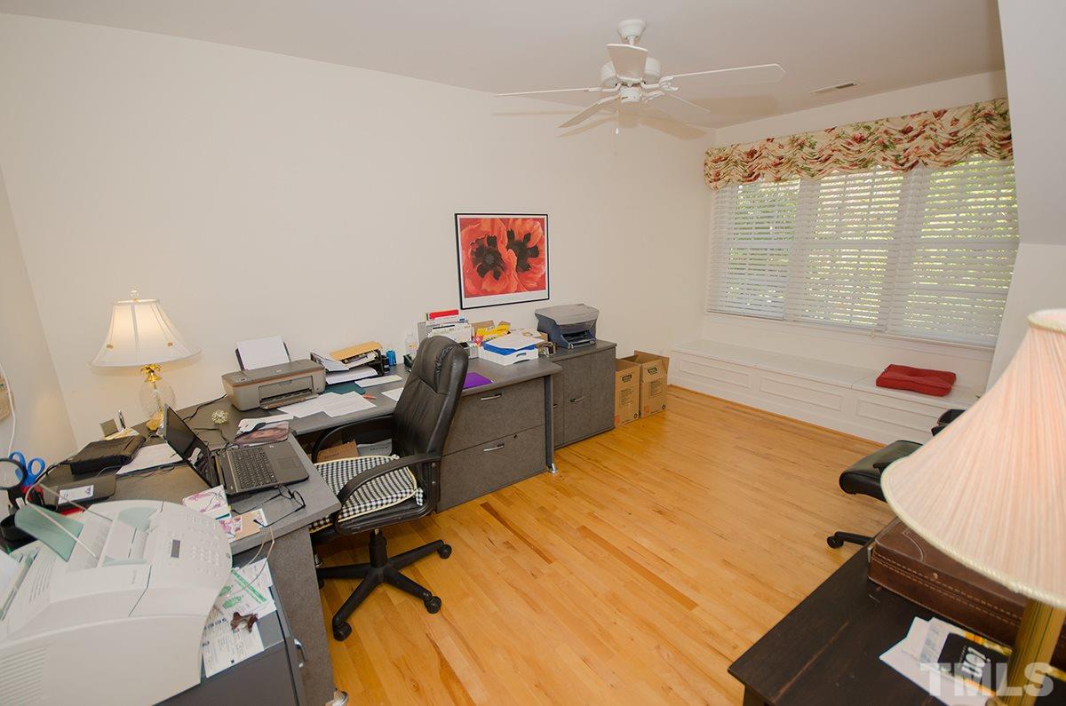 1106 Stanridge Drive Raleigh, NC 27613 - Photo 17 of 24 a bedroom with a bed and wooden floor