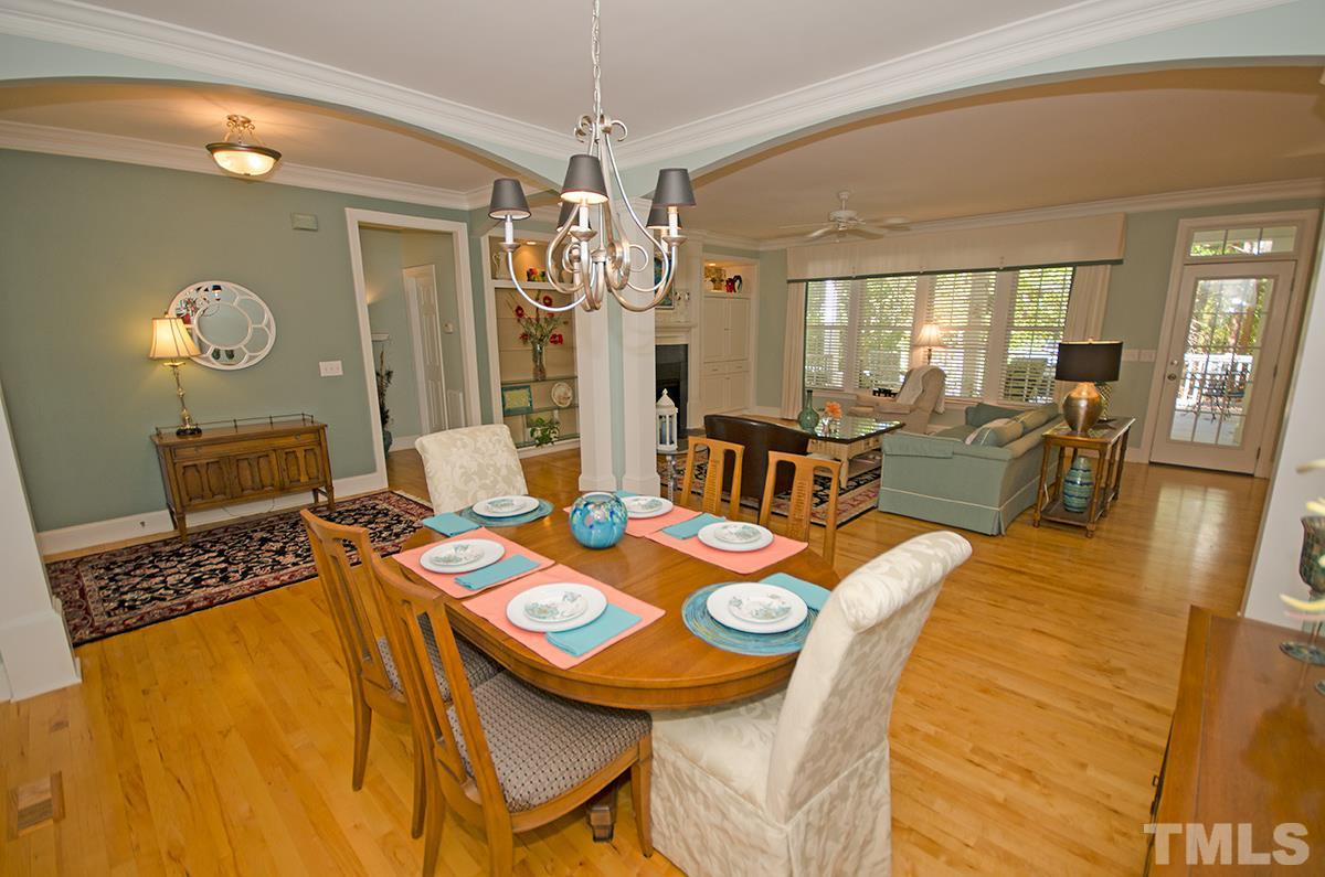 1106 Stanridge Drive Raleigh, NC 27613 - Photo 7 of 24 a view of a dining room with furniture and chandelier