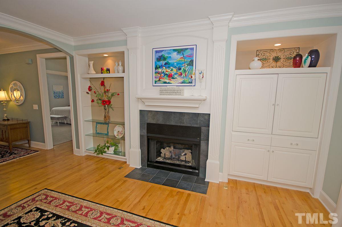 1106 Stanridge Drive Raleigh, NC 27613 - Photo 10 of 24 a living room with furniture and a fireplace