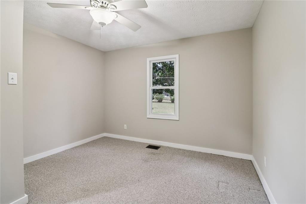 8969 Highway 166 Winston, GA 30187 - Photo 29 of 63 an empty room with a window