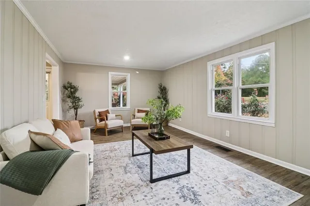 a en suite bathroom with a granite countertop sink and a mirror