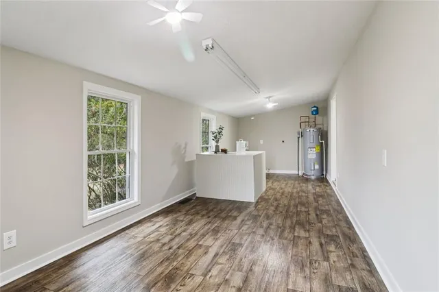 a backyard of a house with yard and outdoor seating