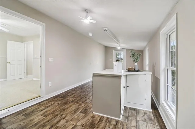 a view of a house with backyard porch and sitting area