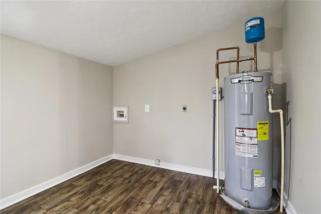 a view of backyard of house with green space