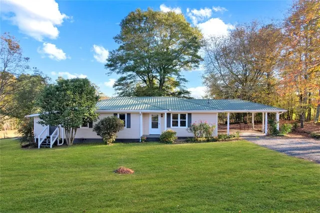 front view of a house with a yard