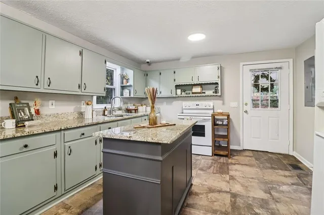 a kitchen with a table and chairs in it