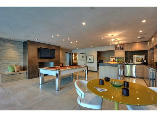 11580 Old Ranch Road Los Altos Hills, CA 94024 - Photo 13 of 22 a living room with furniture a flat screen tv and kitchen view