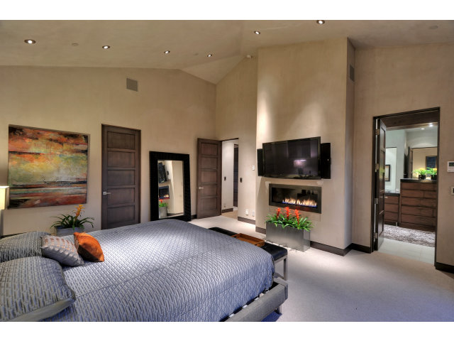 11580 Old Ranch Road Los Altos Hills, CA 94024 - Photo 19 of 22 a bedroom with furniture and a flat screen tv