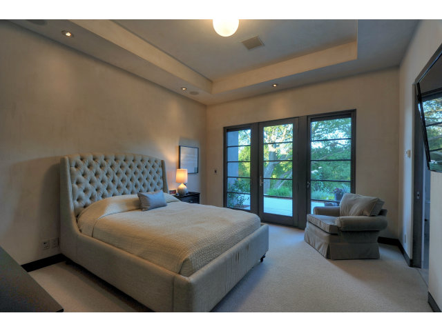 11580 Old Ranch Road Los Altos Hills, CA 94024 - Photo 6 of 22 a bedroom with a large bed and a large window