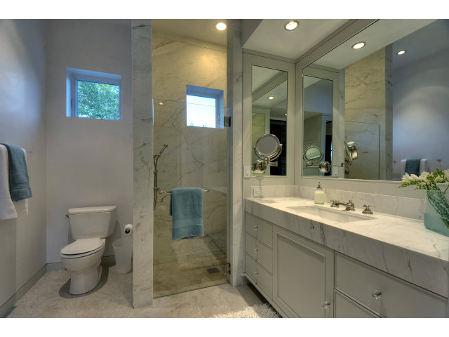 11580 Old Ranch Road Los Altos Hills, CA 94024 - Photo 7 of 22 a bathroom with a toilet a sink and mirror