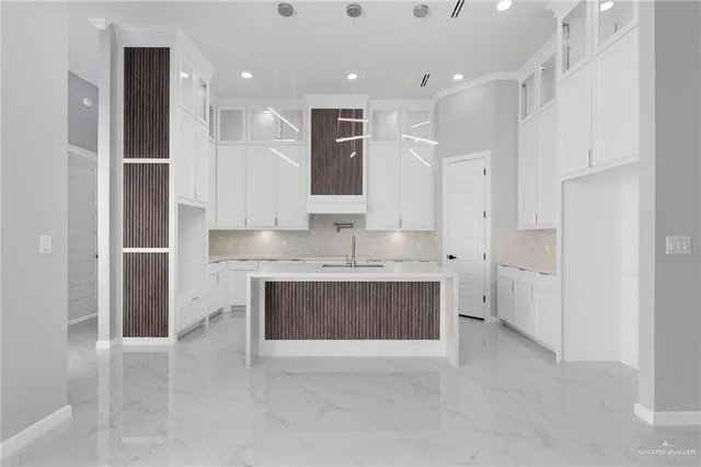 a bathroom with a granite countertop sink mirror and shower