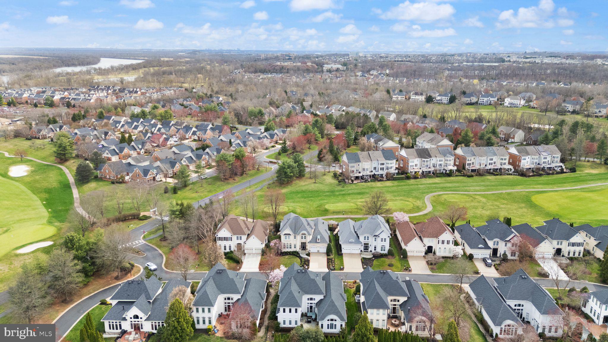 43524 Jackson Hole Circle Leesburg, VA 20176 - Photo 134 of 149 an aerial view of a city with lots of residential buildings ocean and mountain view in back
