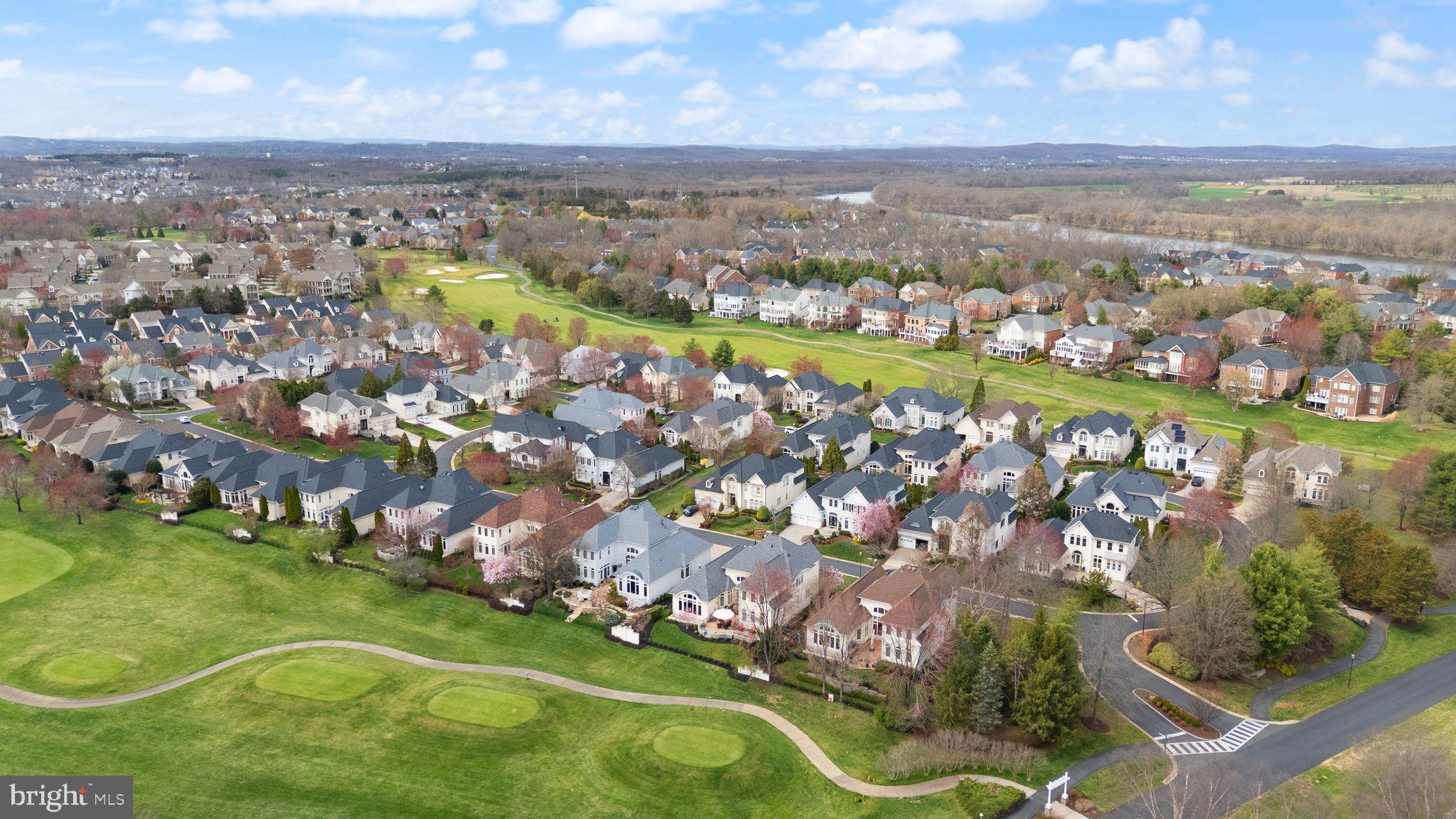 43524 Jackson Hole Circle Leesburg, VA 20176 - Photo 138 of 149 an aerial view of a city with lots of residential buildings ocean and mountain view in back