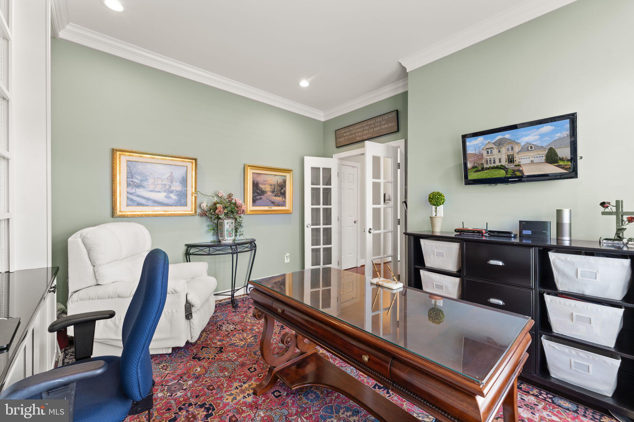 43524 Jackson Hole Circle Leesburg, VA 20176 - Photo 31 of 149 a living room with furniture a desk and chair