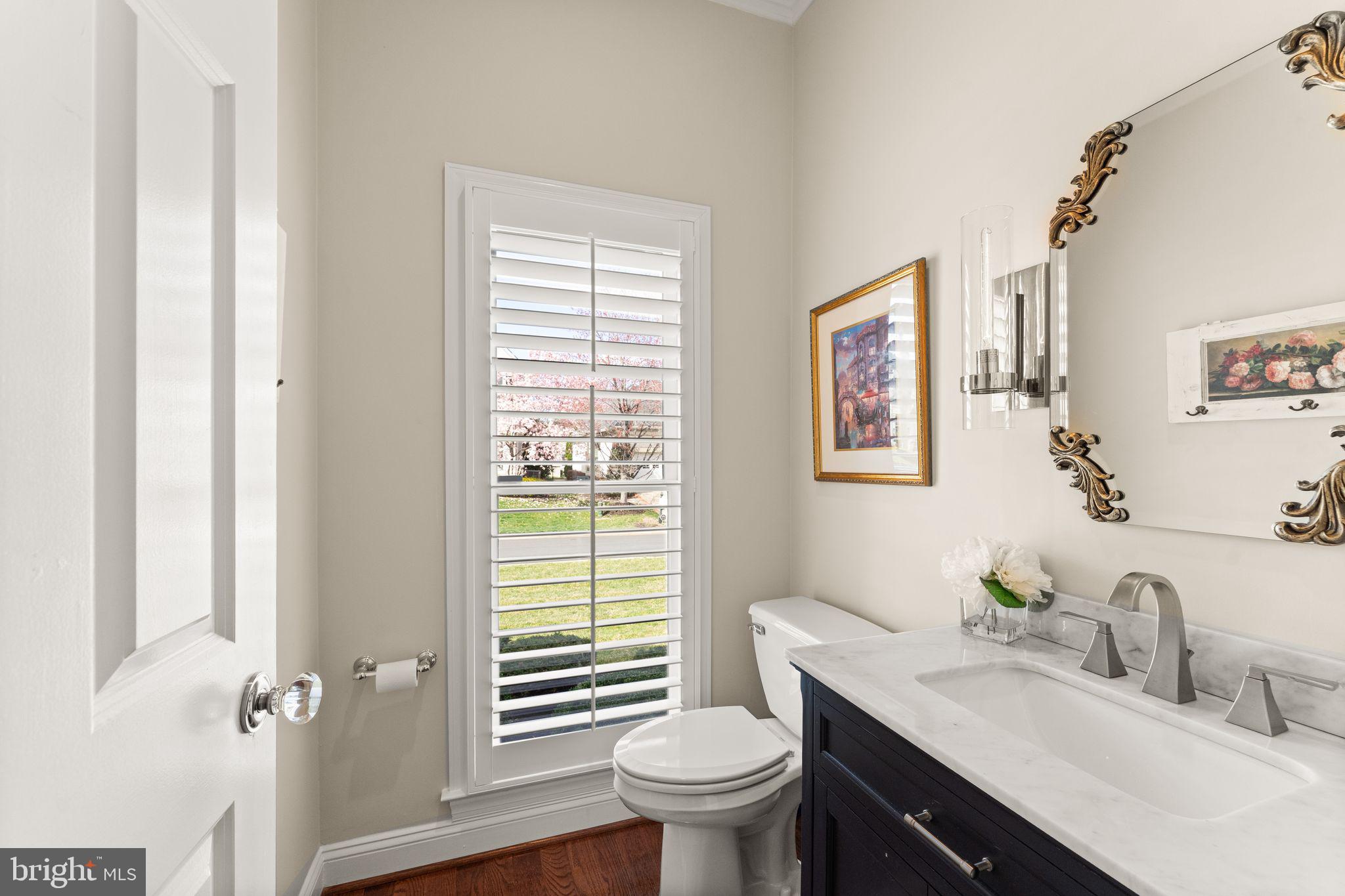 43524 Jackson Hole Circle Leesburg, VA 20176 - Photo 33 of 149 a bathroom with a granite countertop toilet a sink and a window