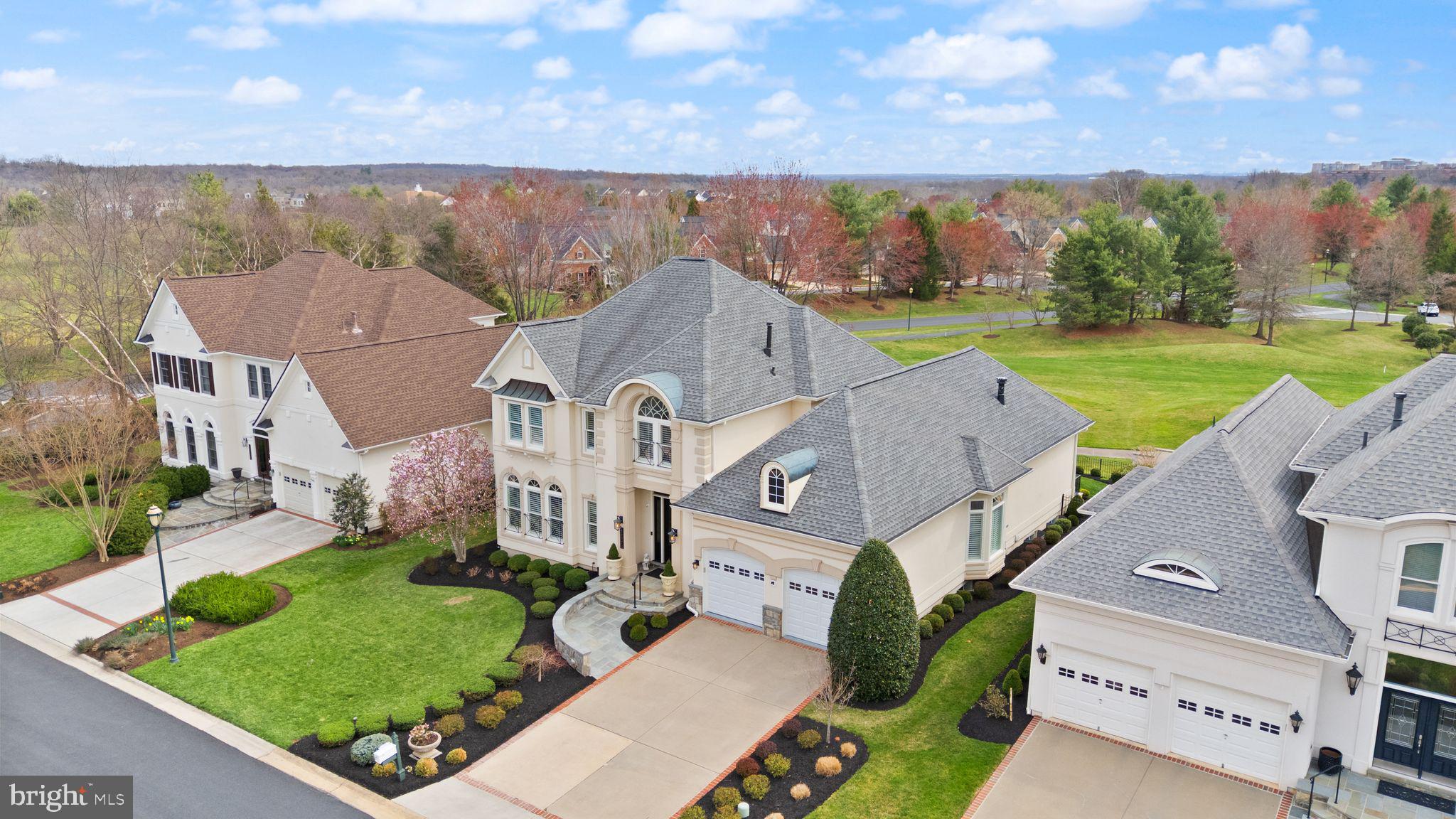 43524 Jackson Hole Circle Leesburg, VA 20176 - Photo 4 of 149 an aerial view of a house with a big yard