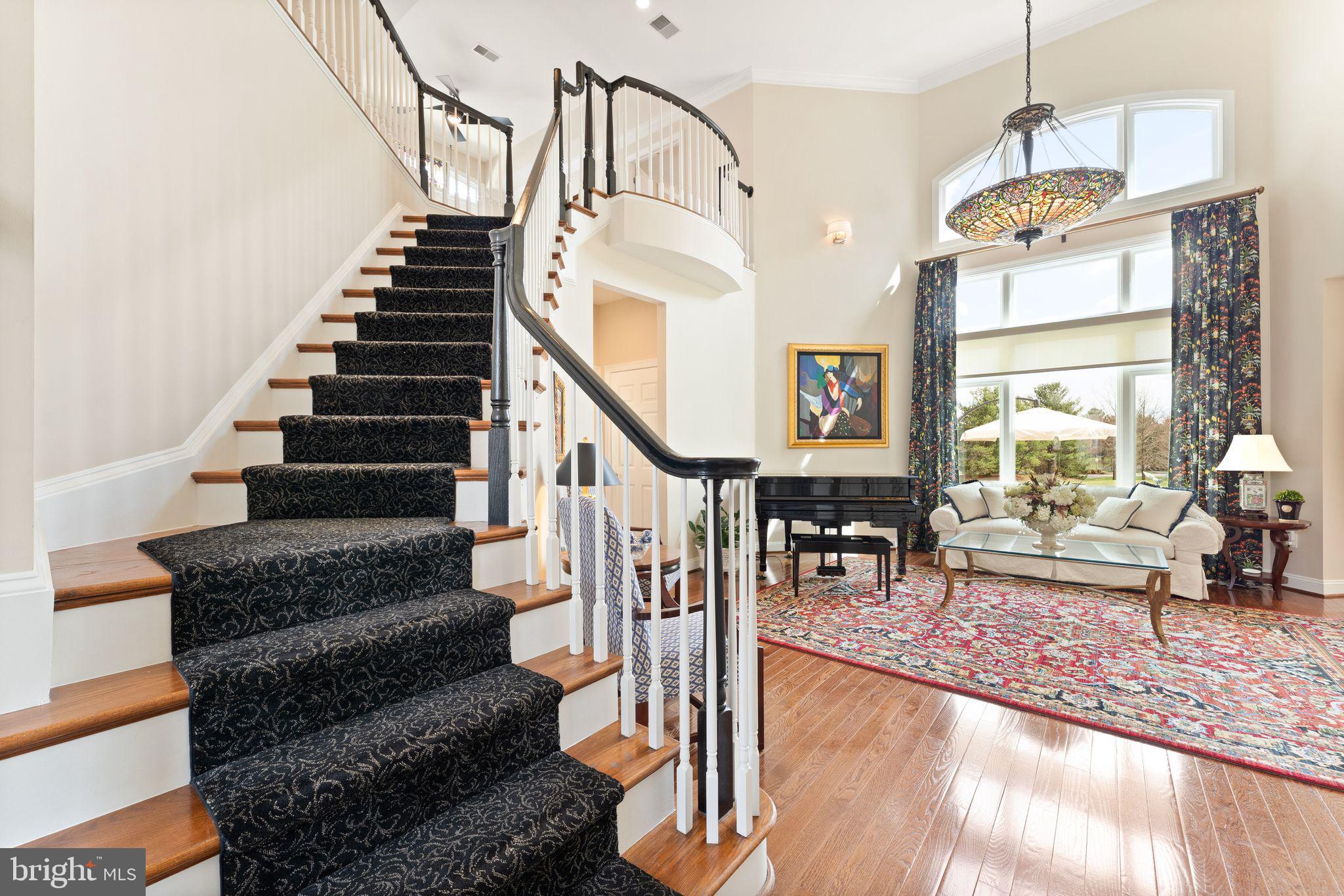 43524 Jackson Hole Circle Leesburg, VA 20176 - Photo 44 of 149 Curved stairs to upper level, living room