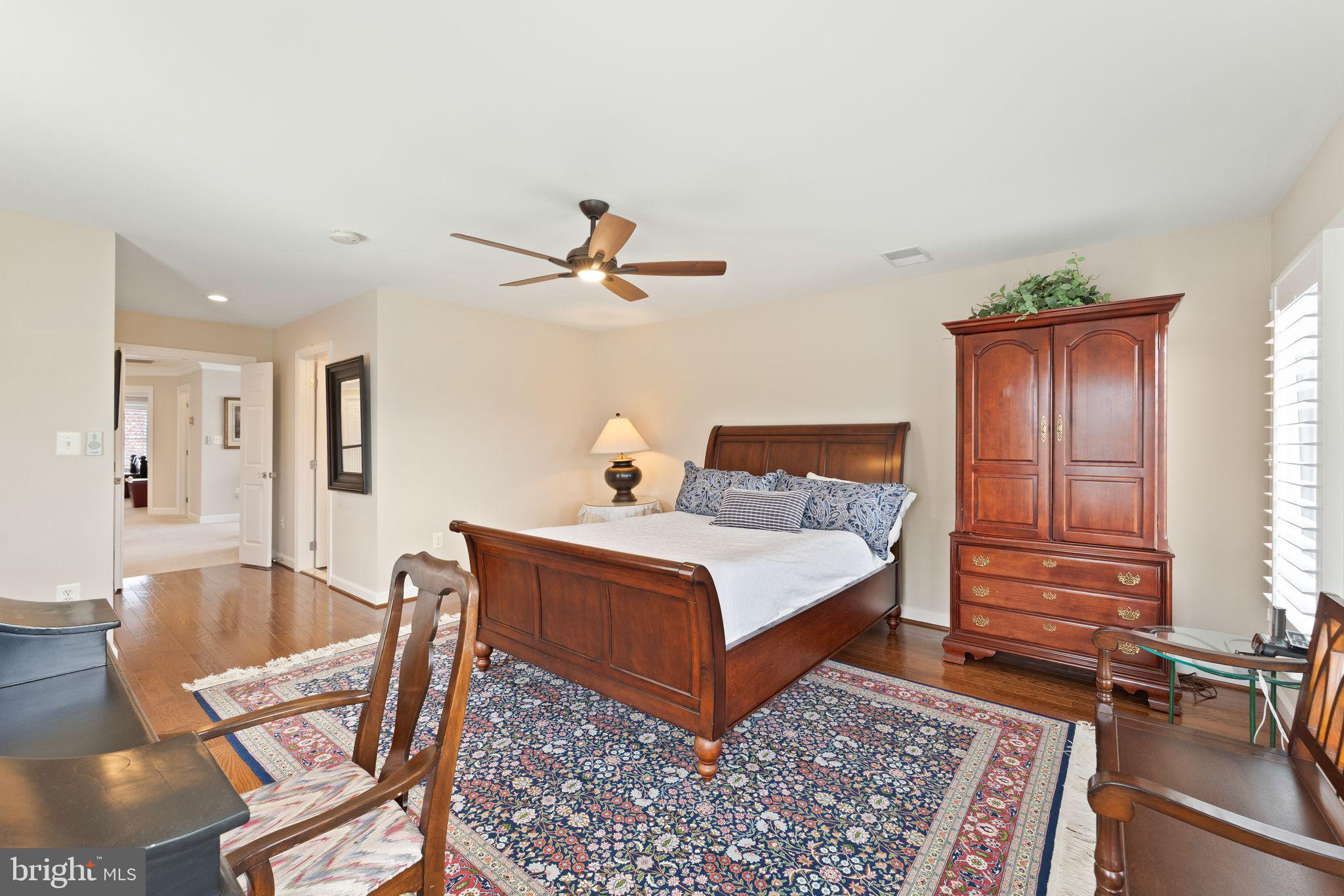 43524 Jackson Hole Circle Leesburg, VA 20176 - Photo 51 of 149 a bedroom with a bed a table and chair