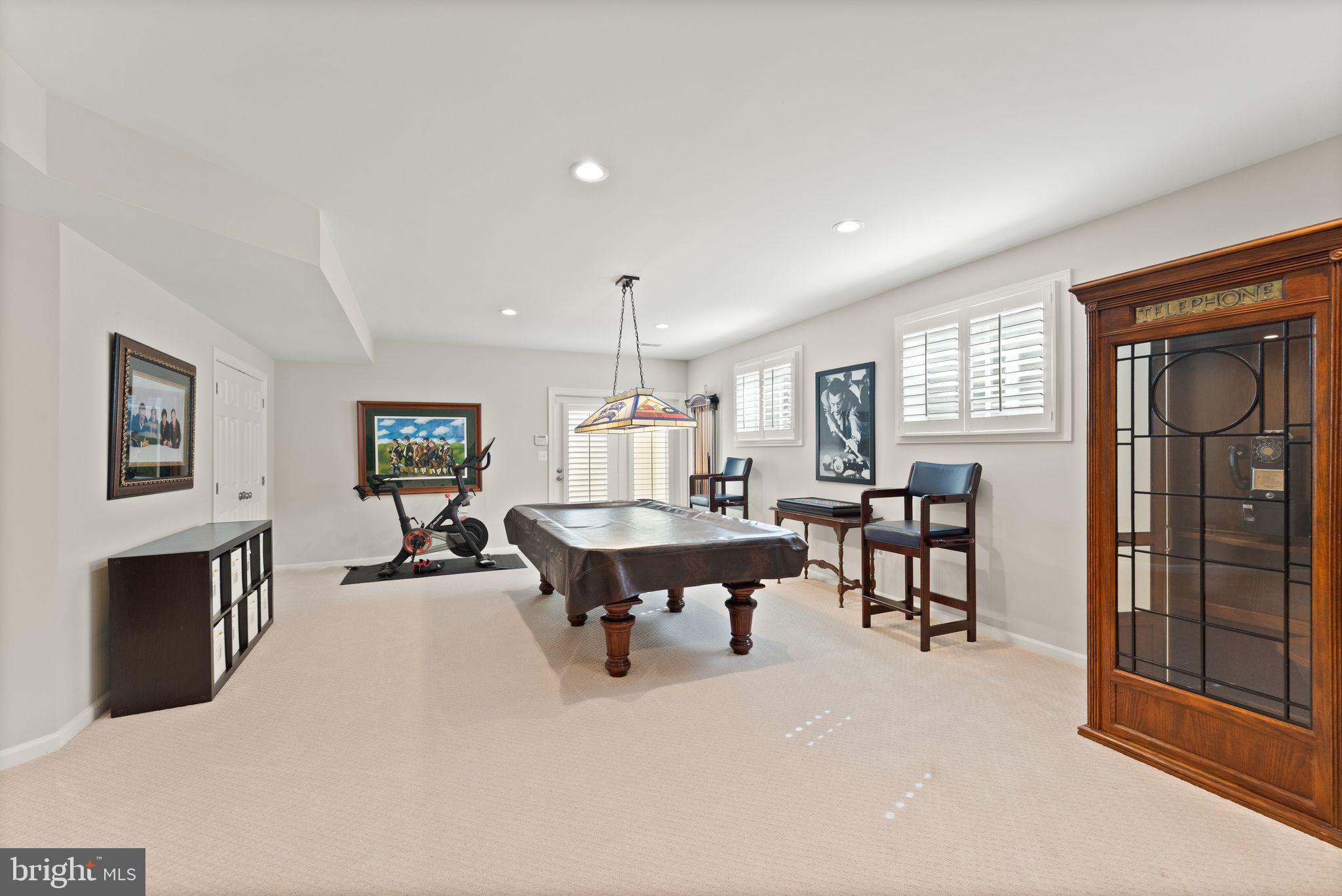 43524 Jackson Hole Circle Leesburg, VA 20176 - Photo 69 of 149 a living room with furniture a fireplace and a table