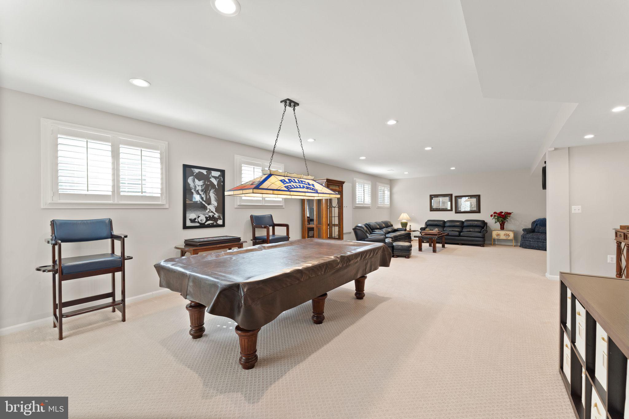 43524 Jackson Hole Circle Leesburg, VA 20176 - Photo 70 of 149 a living room with furniture a table and a chandelier