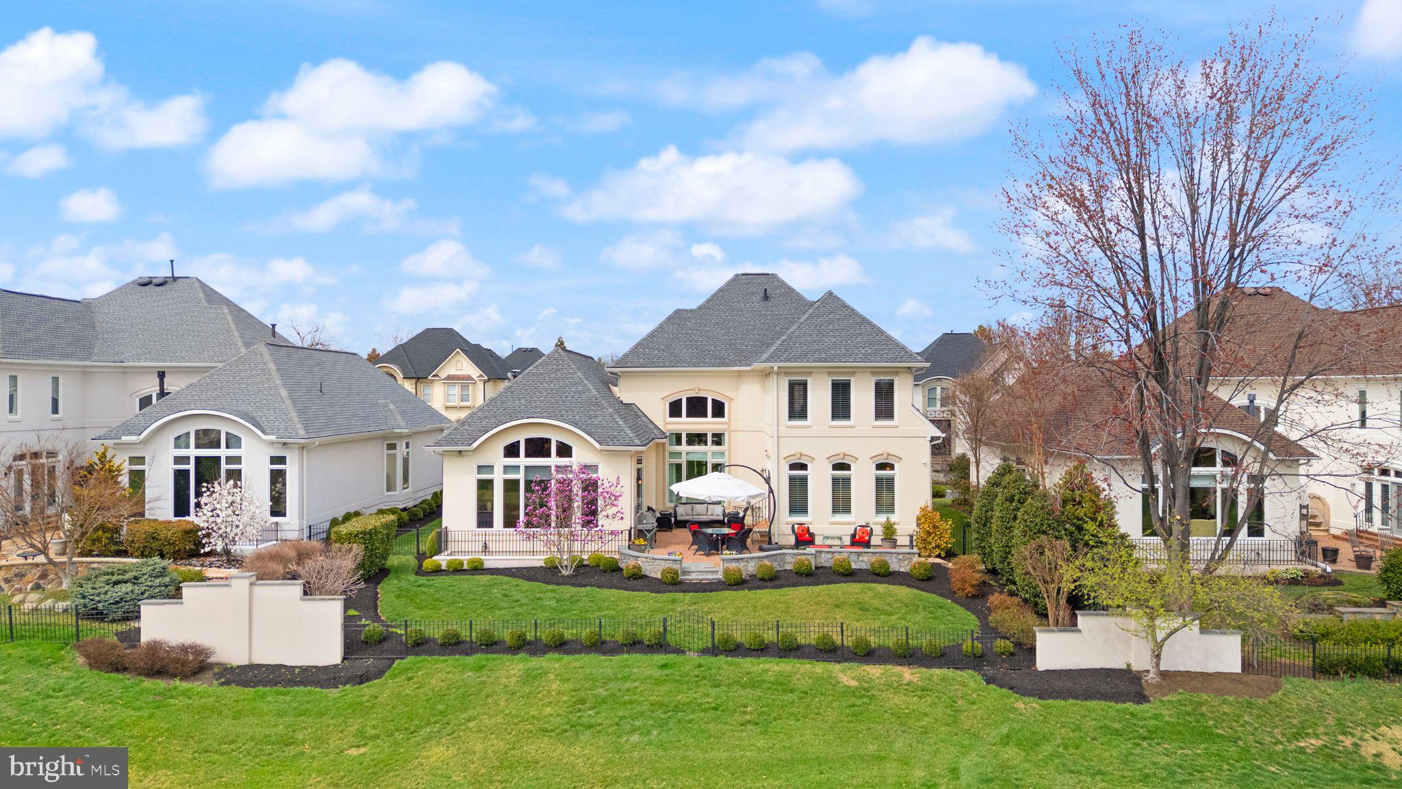 43524 Jackson Hole Circle Leesburg, VA 20176 - Photo 92 of 149 a front view of a house with a garden