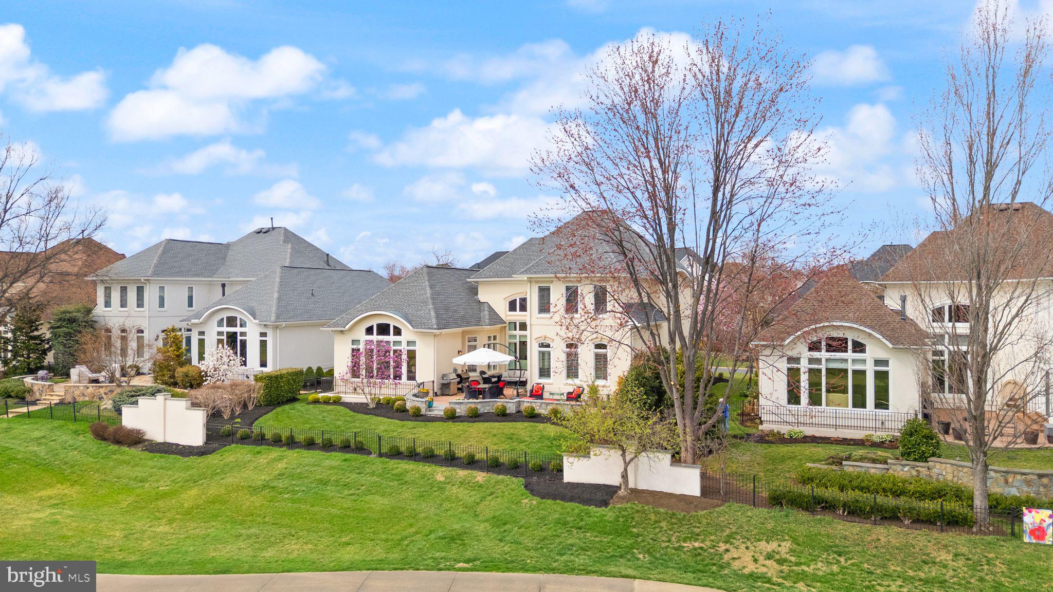 43524 Jackson Hole Circle Leesburg, VA 20176 - Photo 93 of 149 a front view of a house with a garden and plants