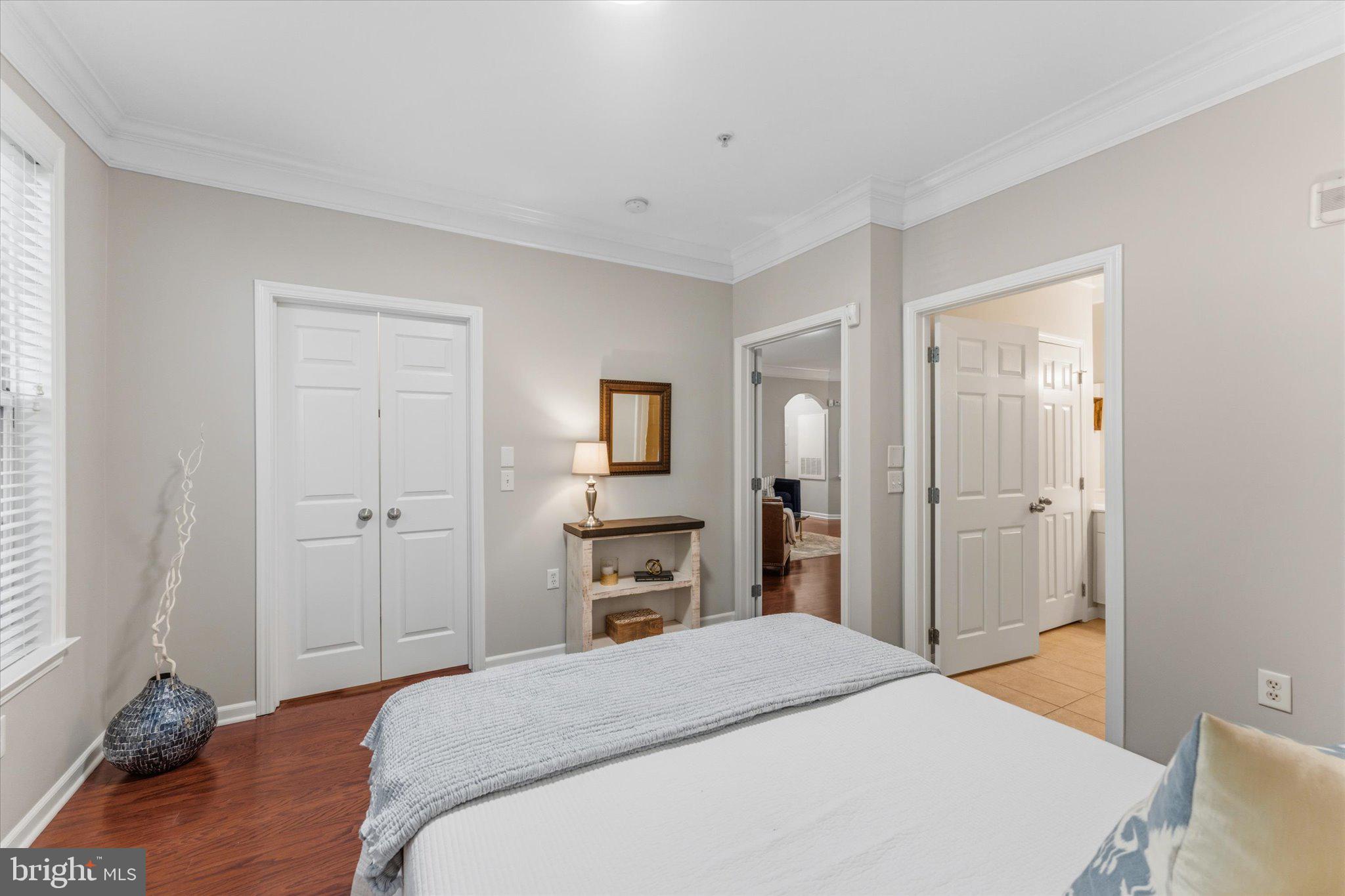 503 Sunset View Terrace Southeast, Unit 101 Leesburg, VA 20175 - Photo 18 of 39 Serene bedroom with inviting charm.