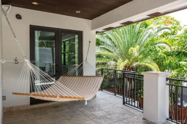 a view of balcony with furniture