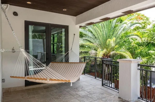 a view of balcony with furniture
